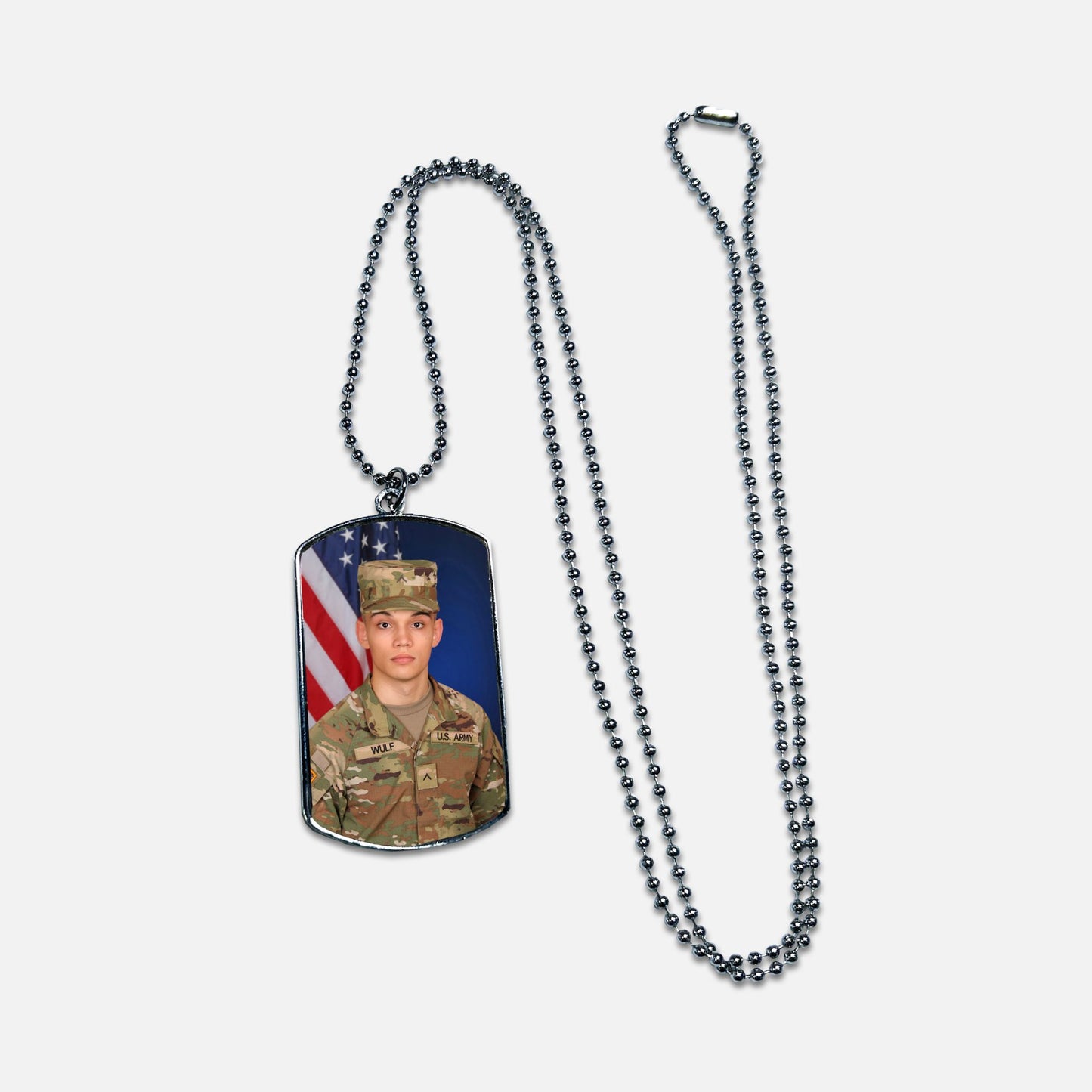Dog tag necklace with a military-themed design on a white background